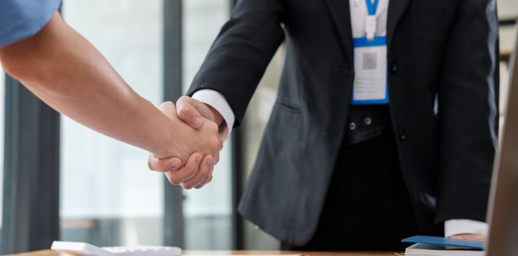 two people shaking hands