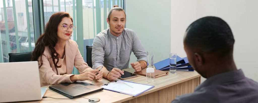 The HR department interviewing a candidate for a frontline security role